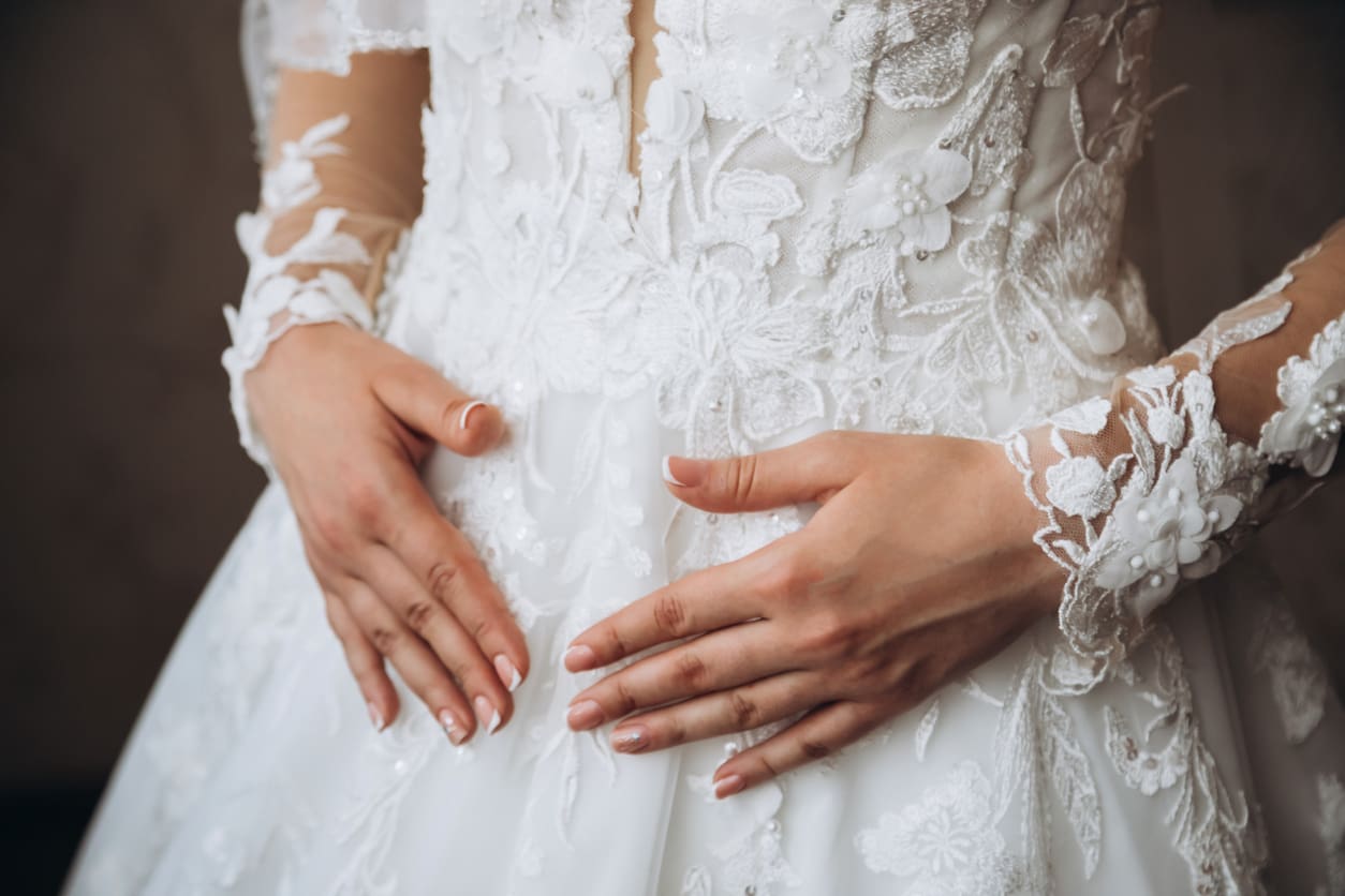 Morning of the bride when she wears a beautiful dress, woman getting ready before wedding ceremony